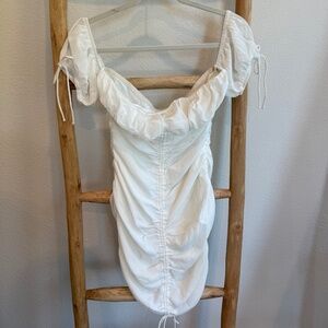 More to Come off the shoulder rouged white dress